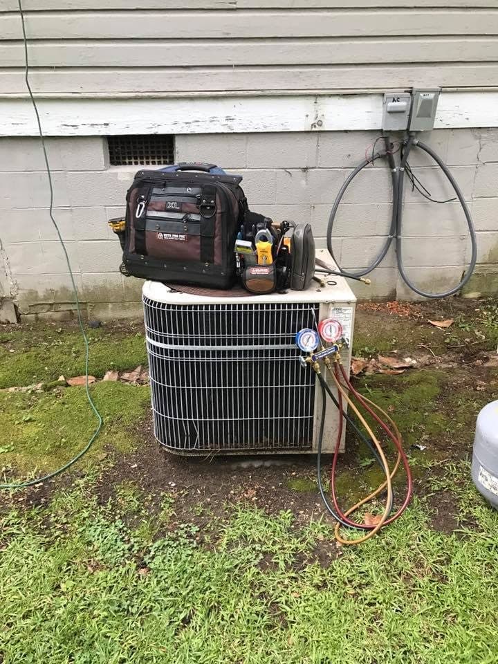 AC condenser serviced with refrigerant gauges in Erwin, NC
